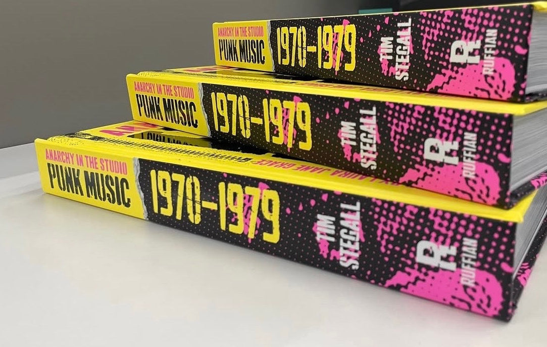 Three Anarchy in the Studio hardcover books stacked showing yellow and pink spines with 1970–1979 lettering and the Ruffian R colophon